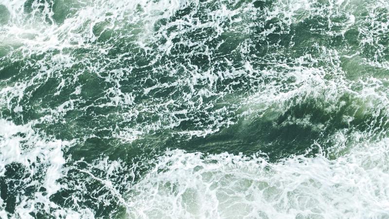 Trader reviewing risk management strategy on computer